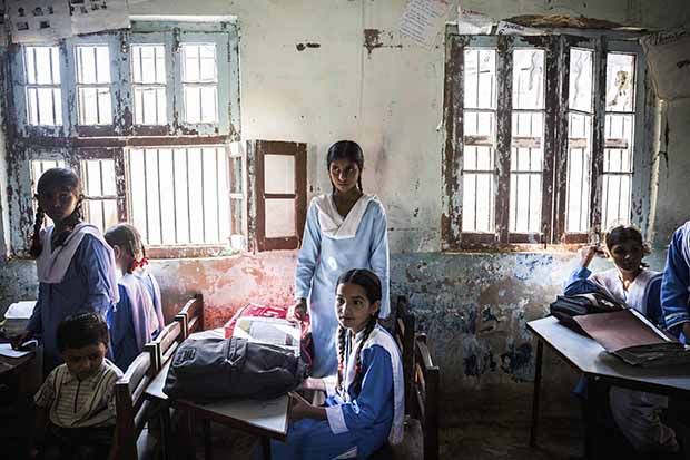 12. Girls await the start of lessons at the primary school in Ch