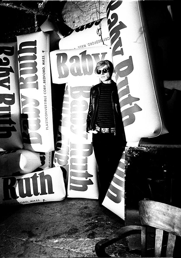 Andy Warhol with giant Baby Ruth bars, 1966