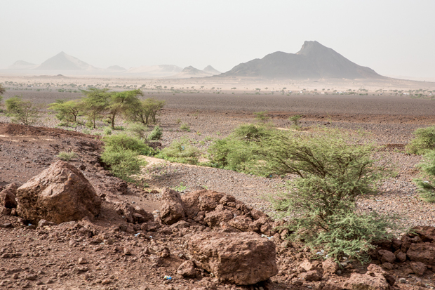 Rocky landscape seen in Zouérat region as iron ore train crosses the Sahara desert from the mine at Zouérat, in northern Mauritania, to the Nouadhibou harbor, on the Atlantic coast of West Africa, as seen on 1st of October 2015.