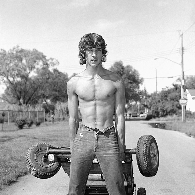 Young Man Pulling a Go-Kart